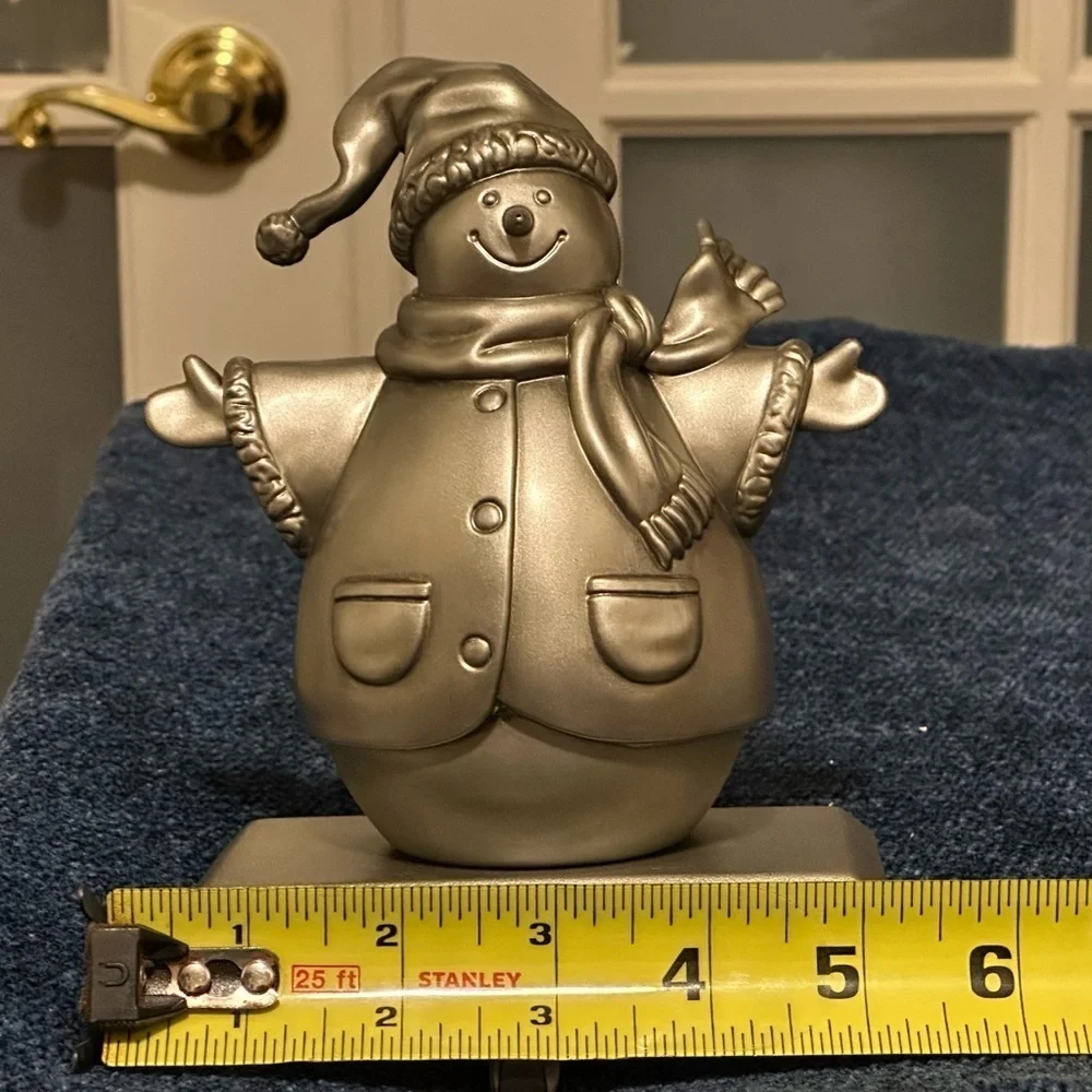 Silver snowman stocking holder. So cute!